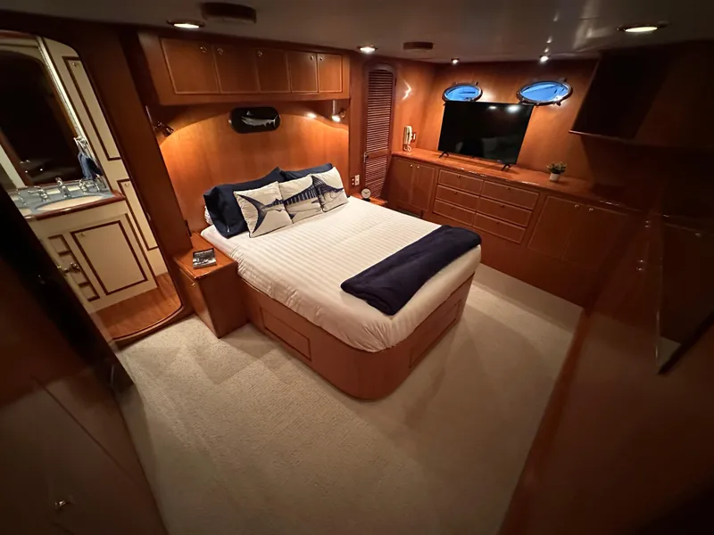 Slide: The Image of Luxurious bedroom interior of a 1999 Mikelson Long-Range Luxury Sportfish yacht. - 19
