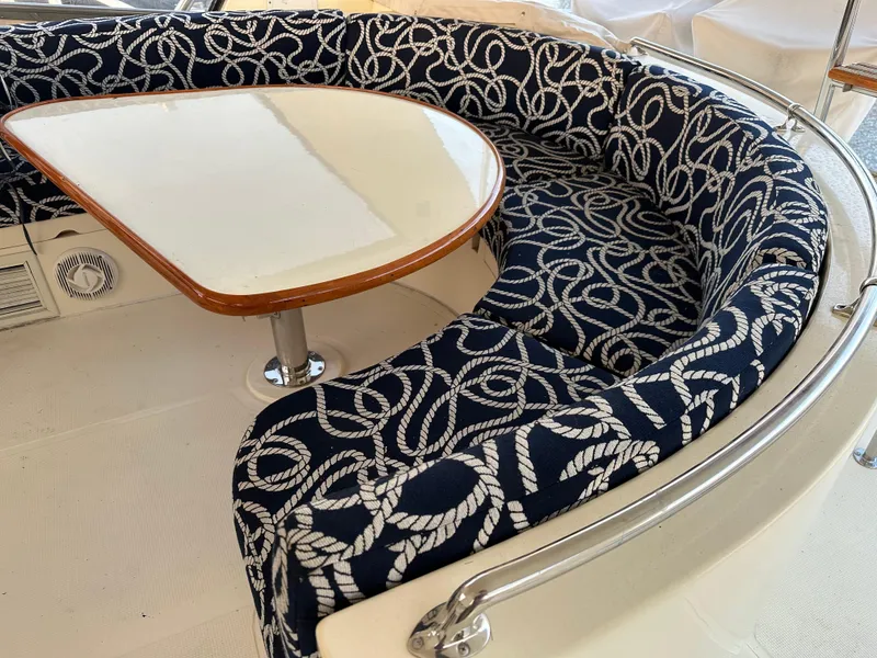 Slide: The Image of Curved seating with nautical rope pattern on a 1999 Mikelson Long-Range Luxury Sportfish yacht. - 46