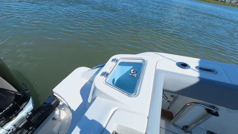 Slide: The Image of Boston Whaler 350 Realm 2026 on calm water. - 14
