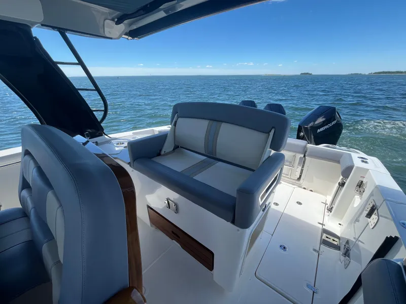 Slide: The Image of Boston Whaler 350 Realm 2026 on water with blue sky. - 29