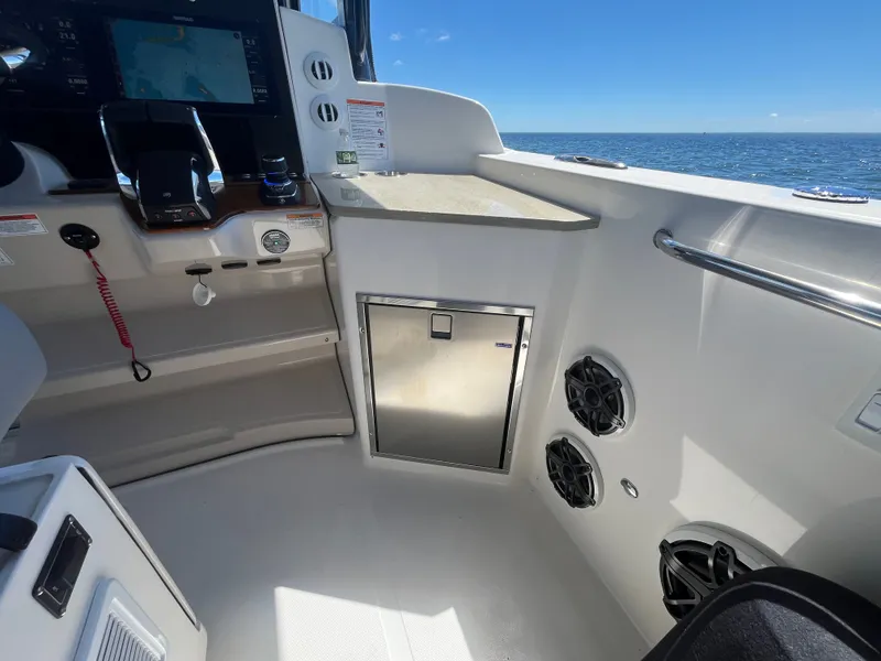 Slide: The Image of Interior of 2026 Boston Whaler 350 Realm with helm console. - 33