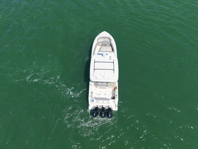 Slide: The Image of Boston Whaler 350 Realm 2026 on water, aerial view. - 4