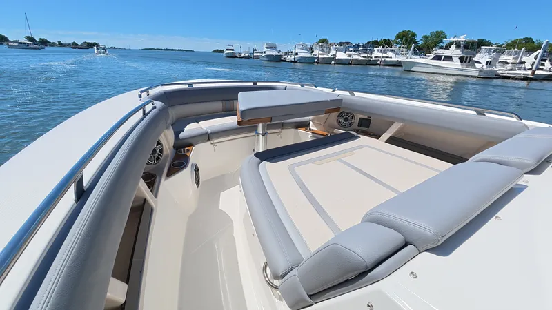 Slide: The Image of Boston Whaler 350 Realm 2026 on calm water near marina. - 42