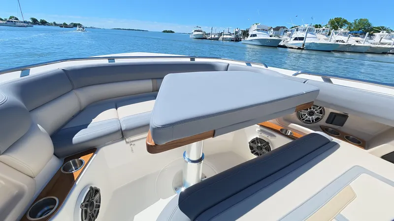Slide: The Image of Boston Whaler 350 Realm 2026 on water with luxurious seating area. - 44