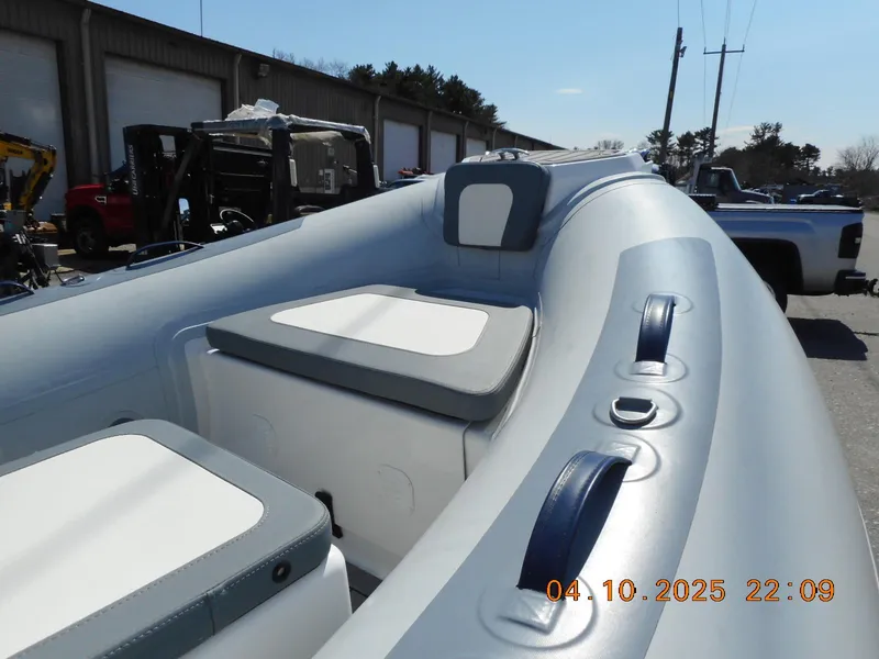 Slide: The Image of 2025 Highfield Classic 400 inflatable boat interior with seating and storage compartments. - 8