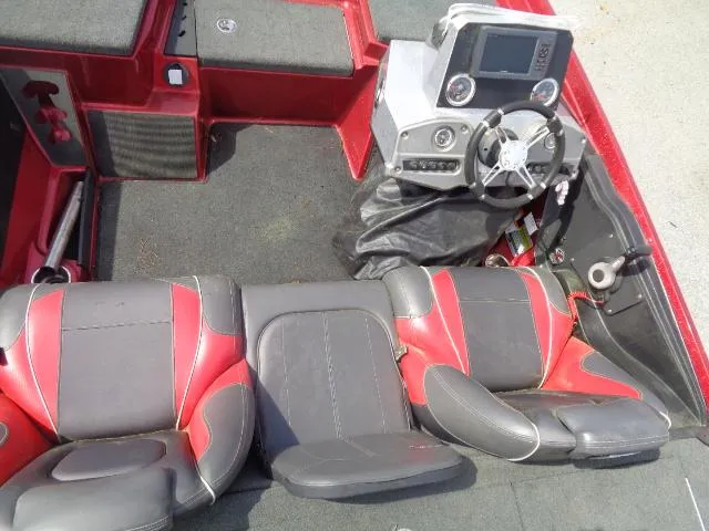 Slide: The Image of 2016 Ranger Z175 boat interior with red and gray seating and steering console. - 3