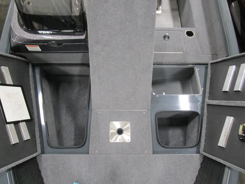 Slide: The Image of 2024 Ranger VS 1682 ANGLER SC boat interior with storage compartments and carpeted flooring. - 10