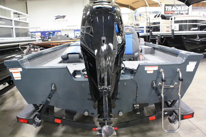 Slide: The Image of 2024 Ranger VS 1682 ANGLER SC boat, rear view with motor, displayed indoors. - 18