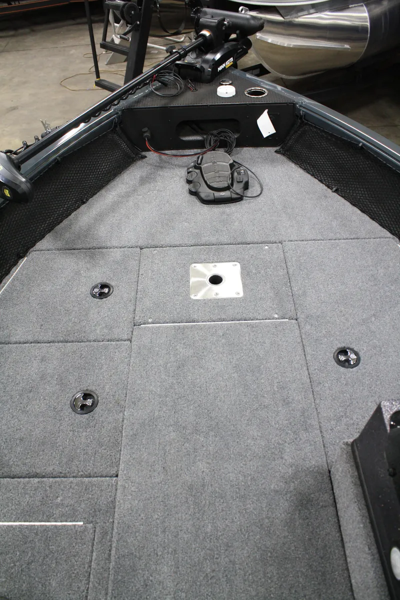 Slide: The Image of 2024 Ranger VS 1682 ANGLER SC boat interior with gray carpeted deck. - 21