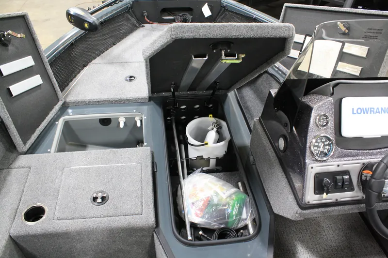 Slide: The Image of 2024 Ranger VS 1682 ANGLER SC boat interior with storage compartments and control panel. - 25