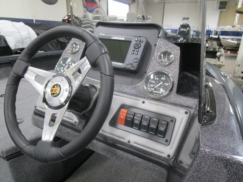 Slide: The Image of 2024 Ranger VS 1682 ANGLER SC boat dashboard with steering wheel and control panel. - 8