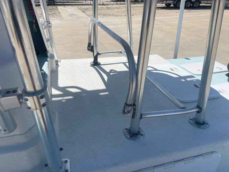 Slide: The Image of 2006 Explorer 19 boat deck with metal railings and storage compartments. - 17