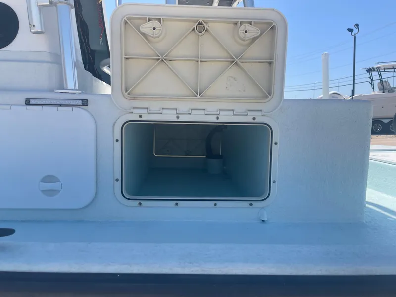 Slide: The Image of Open storage compartment on a 2006 Explorer 19 boat, showcasing interior space. - 20