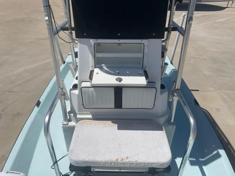 Slide: The Image of 2006 Explorer 19 boat interior with seating and control panel. - 25