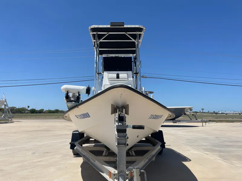 Slide: The Image of 2006 Explorer 19 boat on trailer under clear blue sky. - 3