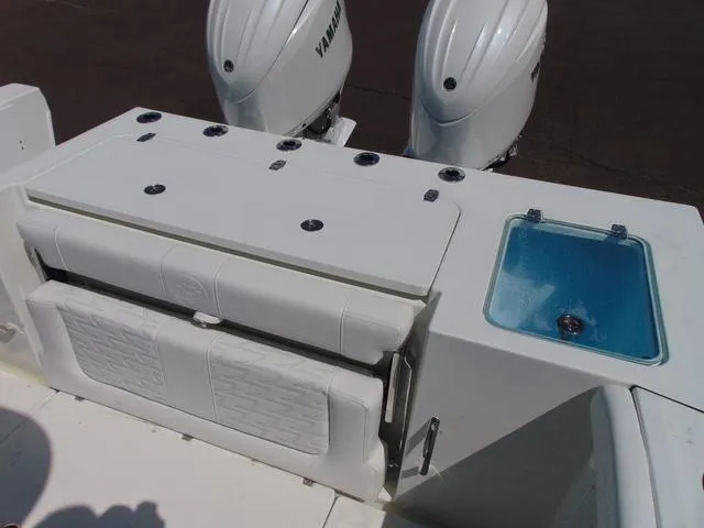 Slide: The Image of 2025 Parker 2600 CC boat with Yamaha engines and seating area. - 10