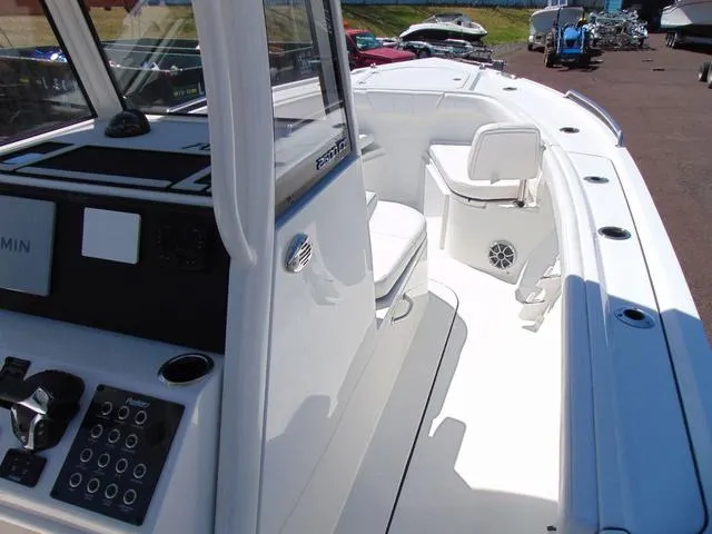 Slide: The Image of 2025 Parker 2600 CC boat interior with modern controls and seating. - 15