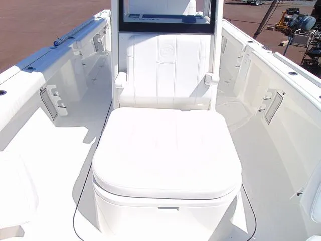 Slide: The Image of 2025 Parker 2600 CC boat interior with white seating and console. - 18