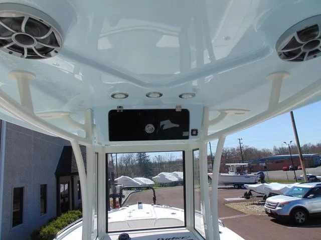 Slide: The Image of 2025 Parker 2200 CC boat interior with speakers and overhead console. - 7
