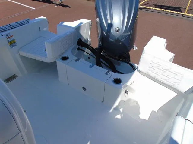 Slide: The Image of 2025 Parker 2200 CC boat interior with seating and engine view. - 9