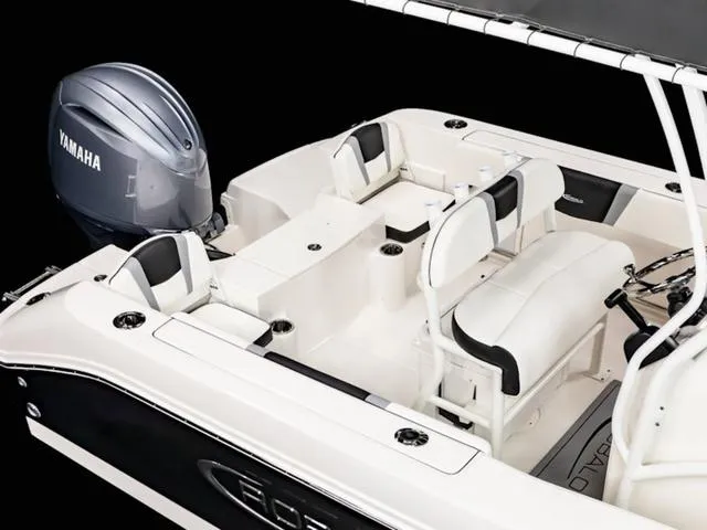Slide: The Image of 2024 Robalo R200 boat interior with Yamaha engine, featuring white seating and sleek design. - 23