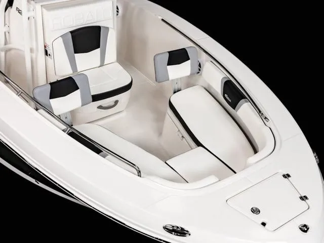 Slide: The Image of 2024 Robalo R200 boat interior with sleek white and black seating design. - 28