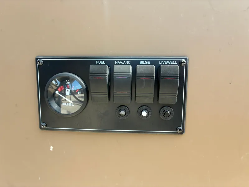 Slide: The Image of Control panel of 2019 Smoker Craft 1660 SPORTSMAN with fuel gauge and switches. - 14