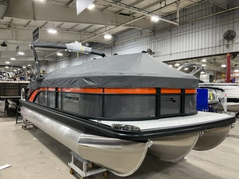 Slide: The Image of 2025 Bennington SX Swingback 22 SXSB pontoon boat in a warehouse, covered and ready for transport. - 14