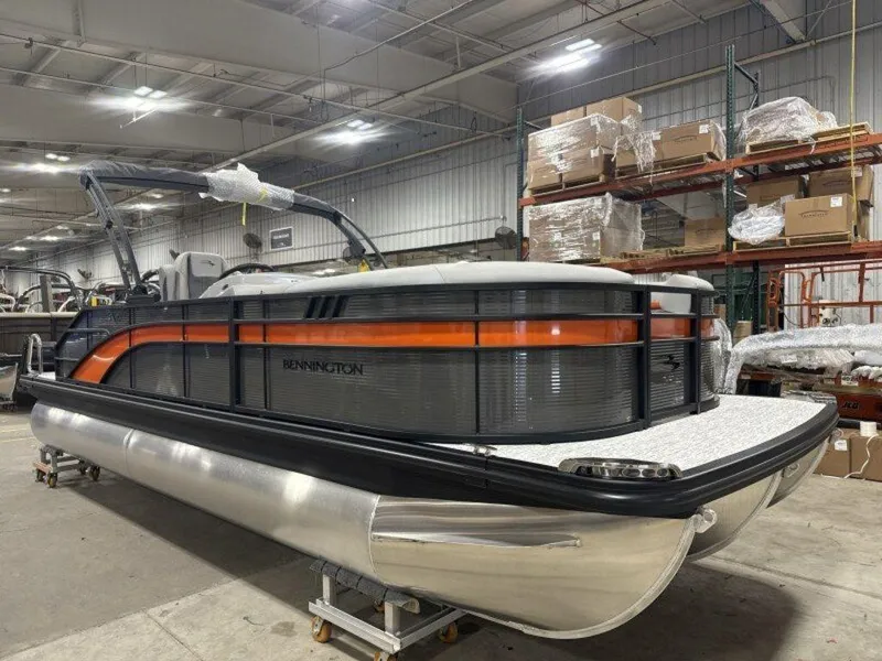 Slide: The Image of 2025 Bennington SX Swingback 22 SXSB pontoon boat in warehouse setting. - 16