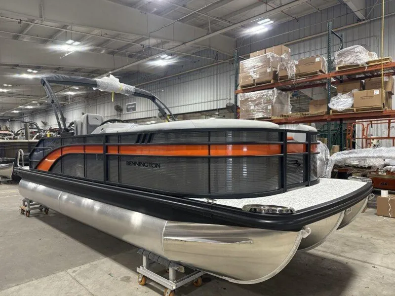 Slide: The Image of 2025 Bennington SX Swingback 22 SXSB pontoon boat in warehouse setting. - 19