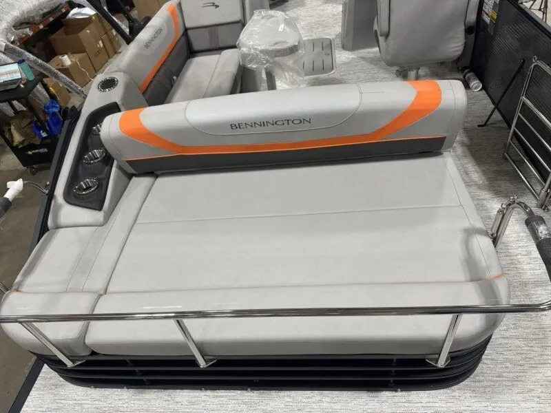 Slide: The Image of 2025 Bennington SX Swingback 22 SXSB pontoon boat with gray and orange seating. - 7