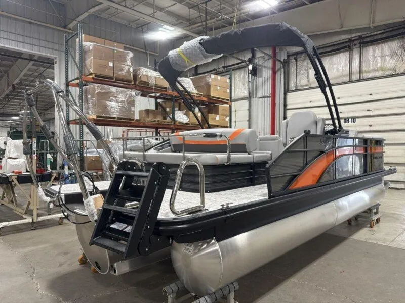 Slide: The Image of 2025 Bennington SX Swingback 22 SXSB pontoon boat in warehouse setting. - 9