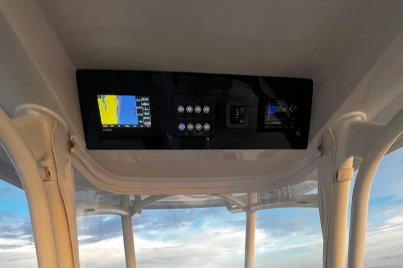 Slide: The Image of Control panel of 2019 Jupiter 30 HFS boat with navigation display. - 3
