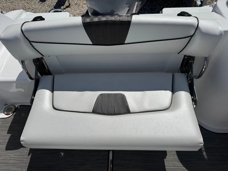 Slide: The Image of 2025 Wellcraft 222 Fisherman boat seat with black and white upholstery. - 15