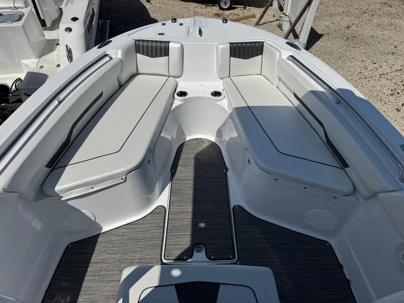 Slide: The Image of 2025 Wellcraft 222 Fisherman boat interior with cushioned seating and sleek design. - 16