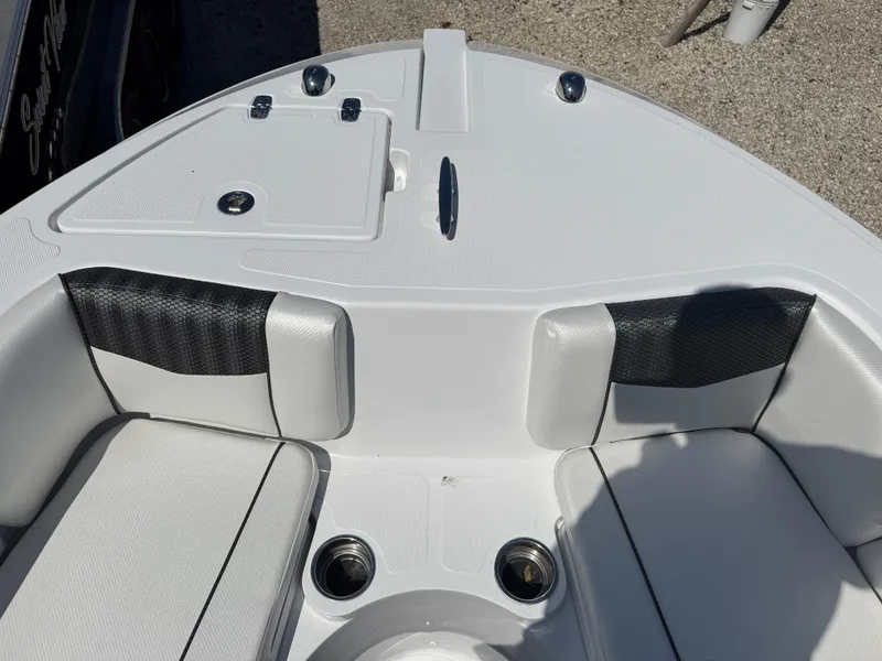 Slide: The Image of 2025 Wellcraft 222 Fisherman boat interior with cushioned seating and storage compartments. - 19