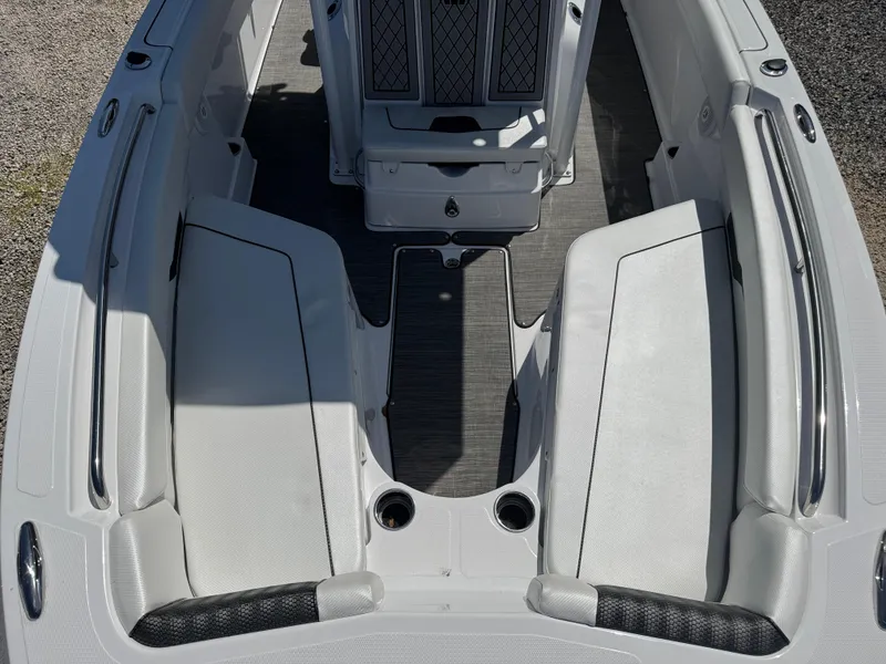 Slide: The Image of 2025 Wellcraft 222 Fisherman boat interior with white seating and sleek design. - 20