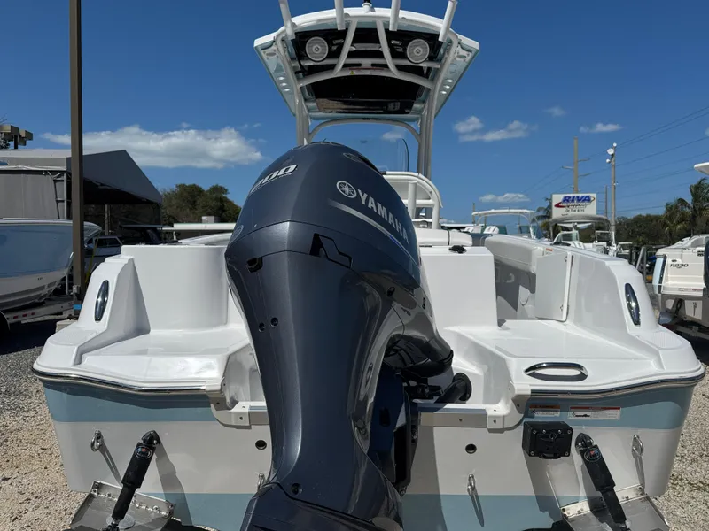 Slide: The Image of 2025 Wellcraft 222 Fisherman boat with Yamaha outboard motor, rear view. - 5