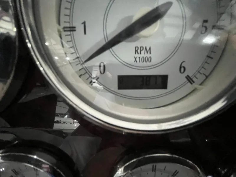Slide: The Image of Close-up of a 2006 Regal 3360 Window Express RPM gauge displaying 381.7 hours. - 13