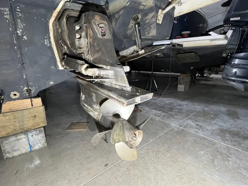 Slide: The Image of 2006 Regal 3360 Window Express boat propeller and stern drive in a garage. - 18