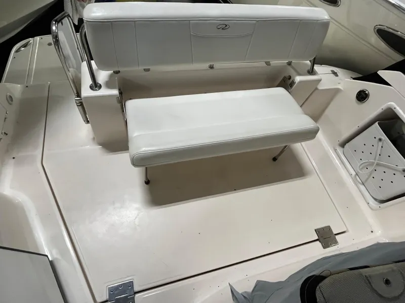 Slide: The Image of 2006 Regal 3360 Window Express boat seating area with white upholstery. - 22