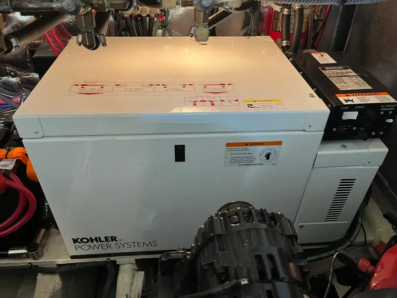 Slide: The Image of Kohler Power Systems generator in a 2006 Regal 3360 Window Express boat engine room. - 25