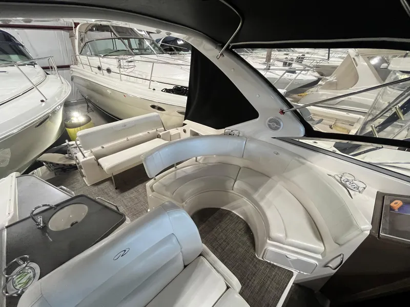 Slide: The Image of 2006 Regal 3360 Window Express boat interior with white seating and modern design. - 3