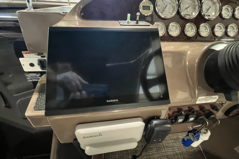 Slide: The Image of Control panel of a 2006 Regal 3360 Window Express with Garmin navigation system. - 35