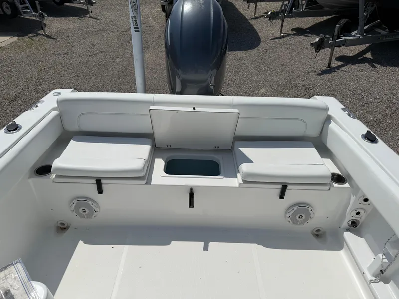 Slide: The Image of 2014 Sea Hunt Escape 211 LE boat interior with seating and storage compartments. - 12