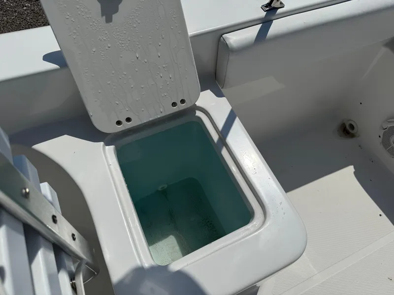 Slide: The Image of 2014 Sea Hunt Escape 211 LE boat livewell with open lid, showing interior. - 16