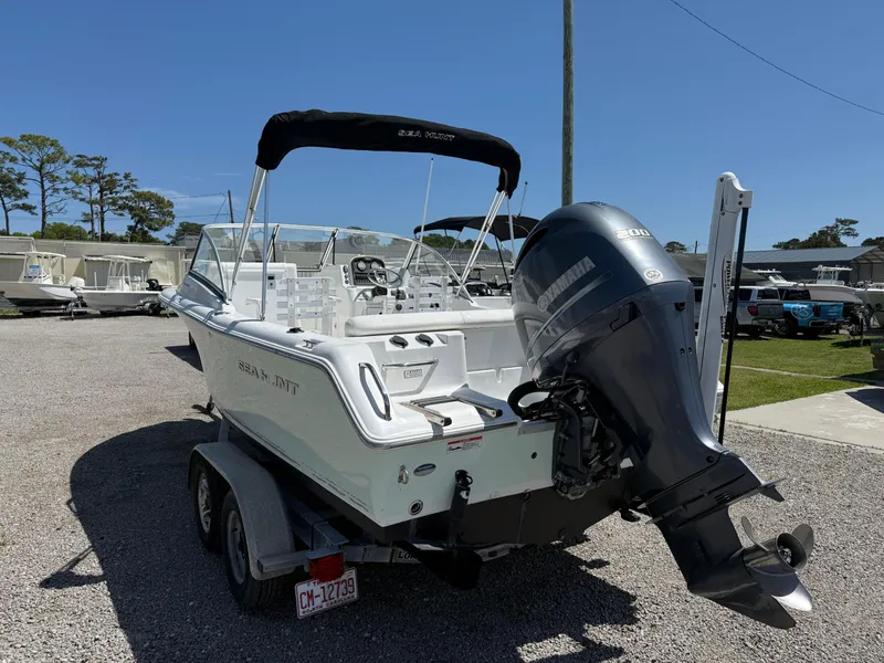 Slide: The Image of 2014 Sea Hunt Escape 211 LE boat on trailer with Yamaha outboard motor. - 3