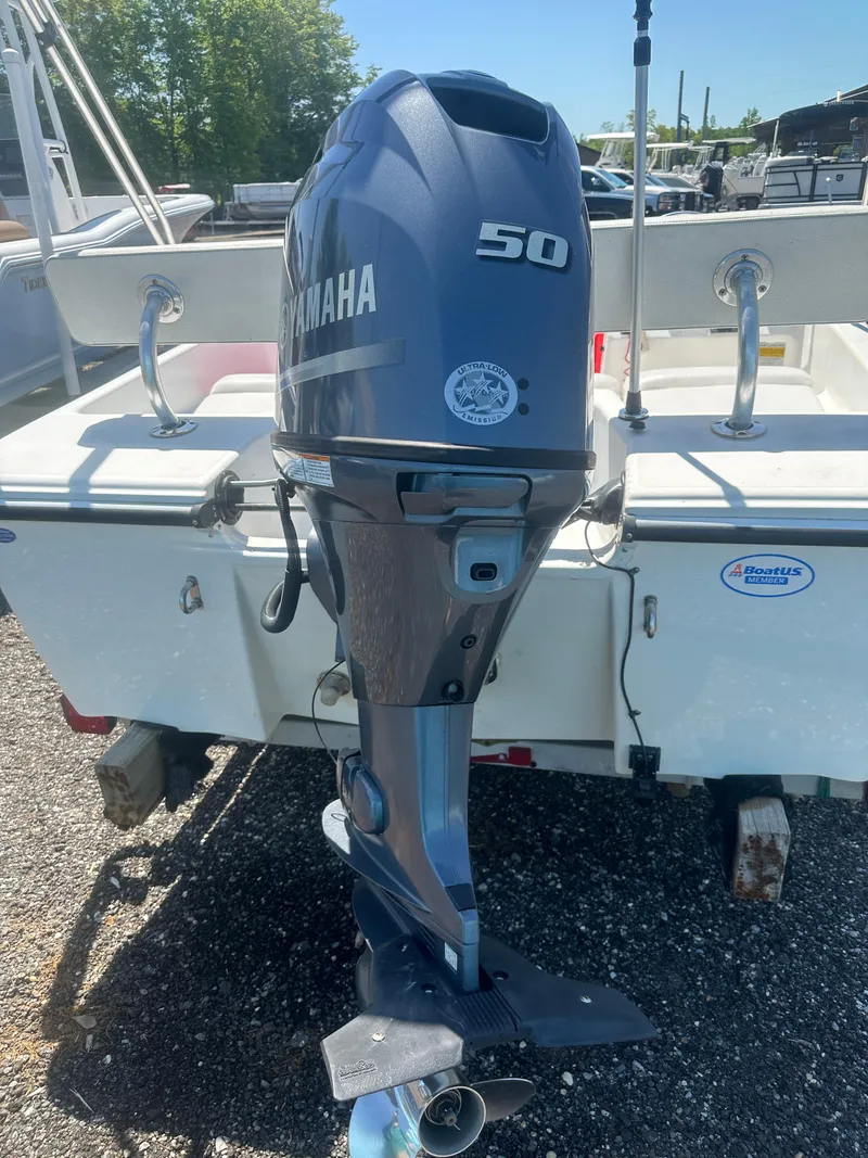 Slide: The Image of Outboard motor on 2002 Edgewater 135ST boat, featuring a Yamaha 50 engine. - 17