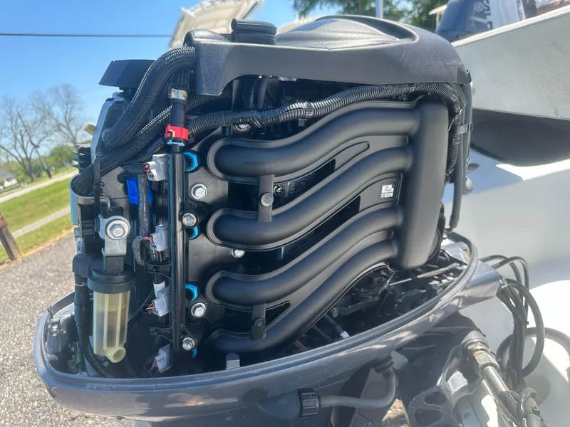 Slide: The Image of 2002 Edgewater 135ST boat engine, detailed view of components and wiring. - 19