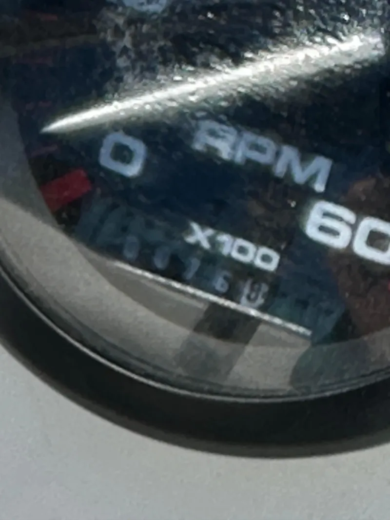 Slide: The Image of Close-up of a 2002 Edgewater 135ST RPM gauge displaying 7600 RPM. - 20